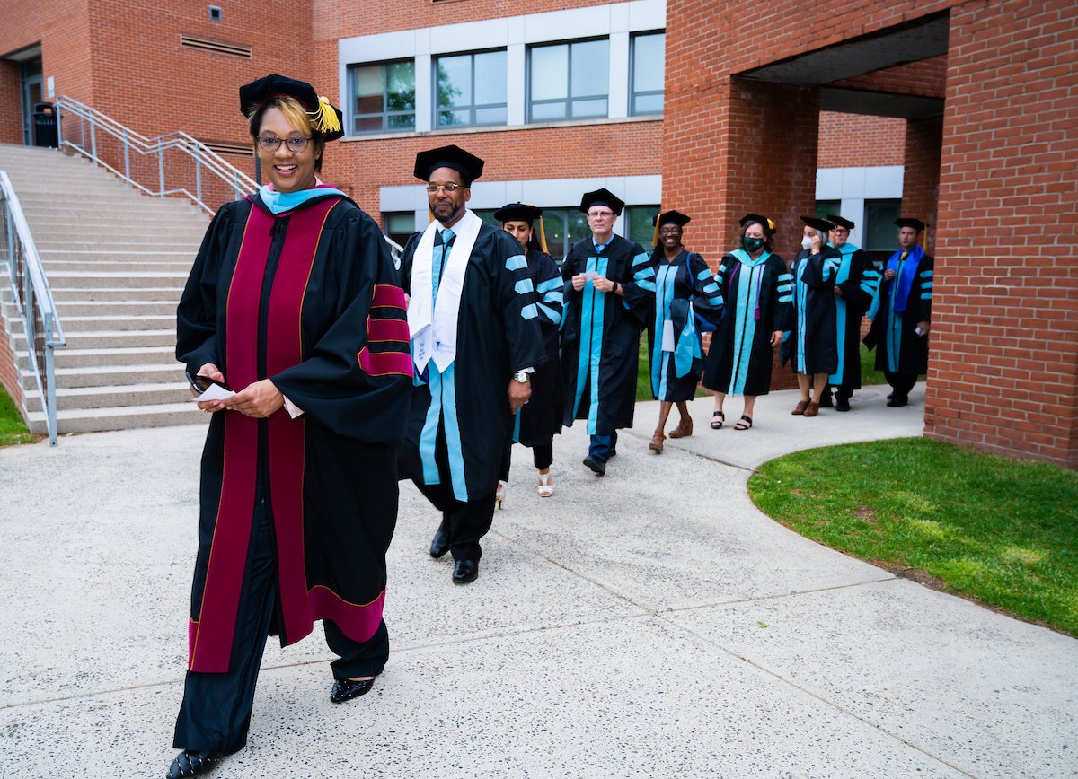 Mary Boudreaux leading staff in front of Engleman Hall