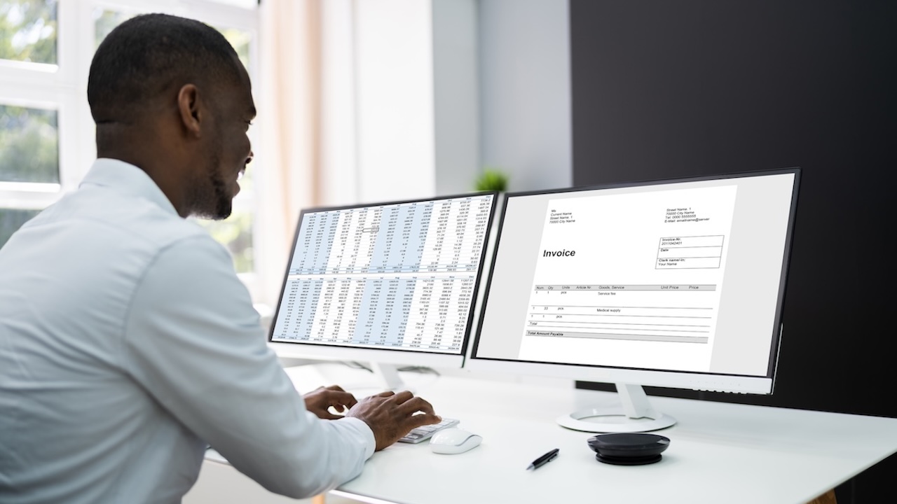 A graduate student working on a financial risk management system on a computer