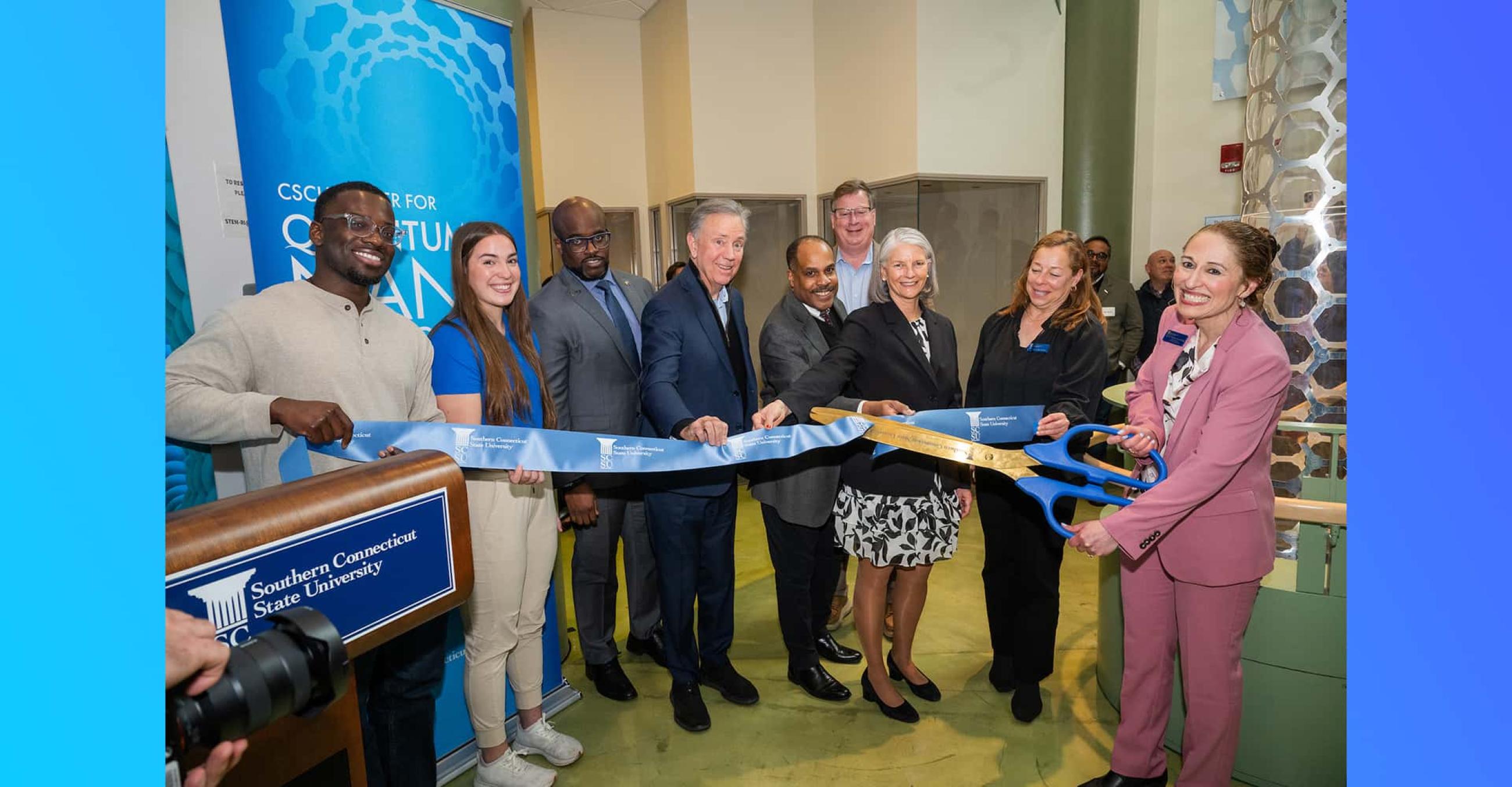 From left: Crossby Dessalines; Maggie Blanchard; Dr. John Maduko; Governor Ned Lamont; Dr. Al Green; Marty Guay; Dr. Sandra Bulmer; Dr. Julia Irwin; and Dr. Christine Broadbridge at the QNT Center ribbon cutting on March 23