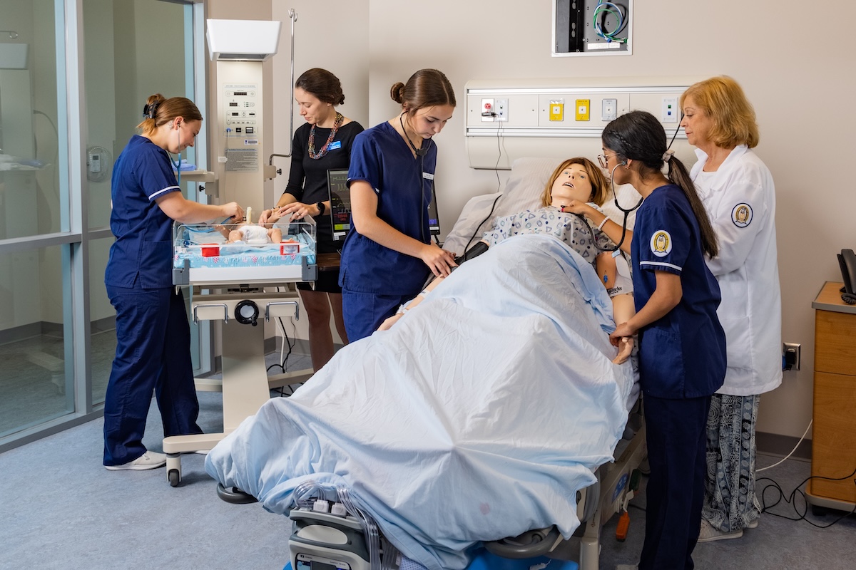 Nursing students with a patient simulator