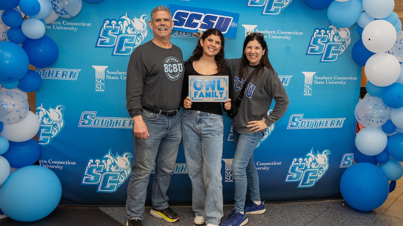 Family stands proudly together as another family member is accepted to Southern Connecticut State University